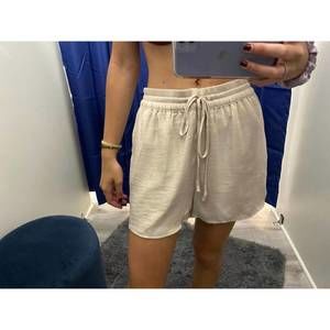 NEW KLD. SIGNATURE satin drawstring shorts in beige